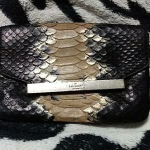 Kate Spade Snake skin clutch used but good conditi